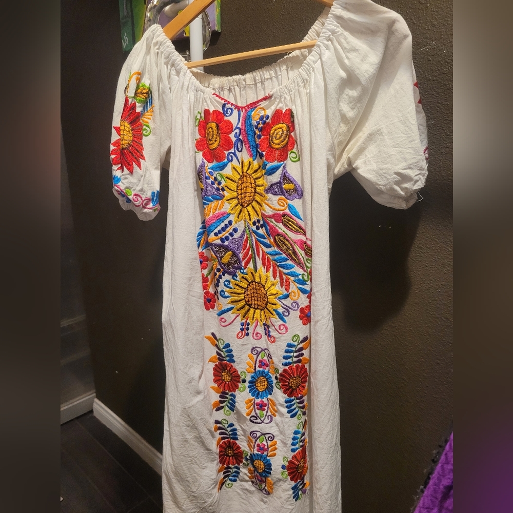 White Embroidered Knee Length Dress with  elastic neckline.